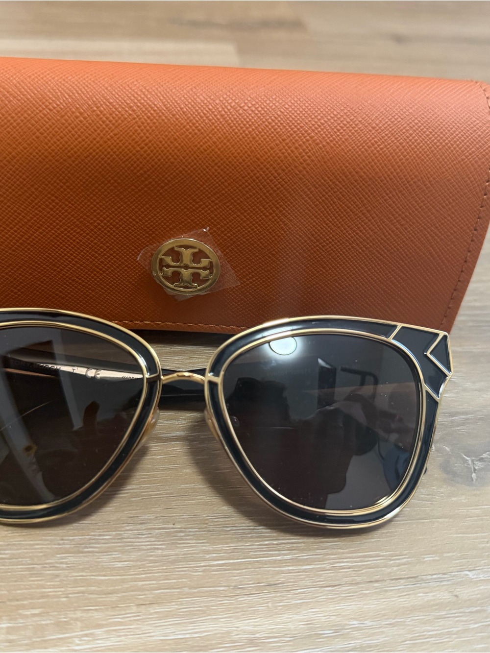 Tory Burch Black and Gold Cat-Eye Sunglasses with Orange Case